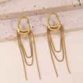 Boucles pendantes sculpturale dorée